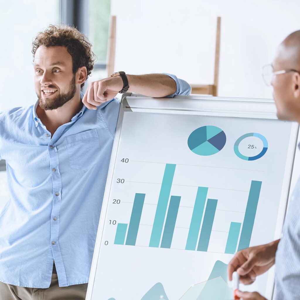 multiethnic businessmen standing near white board 74gv65m.jpg